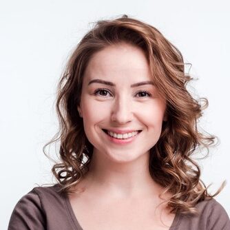Smiling girl on a white background.